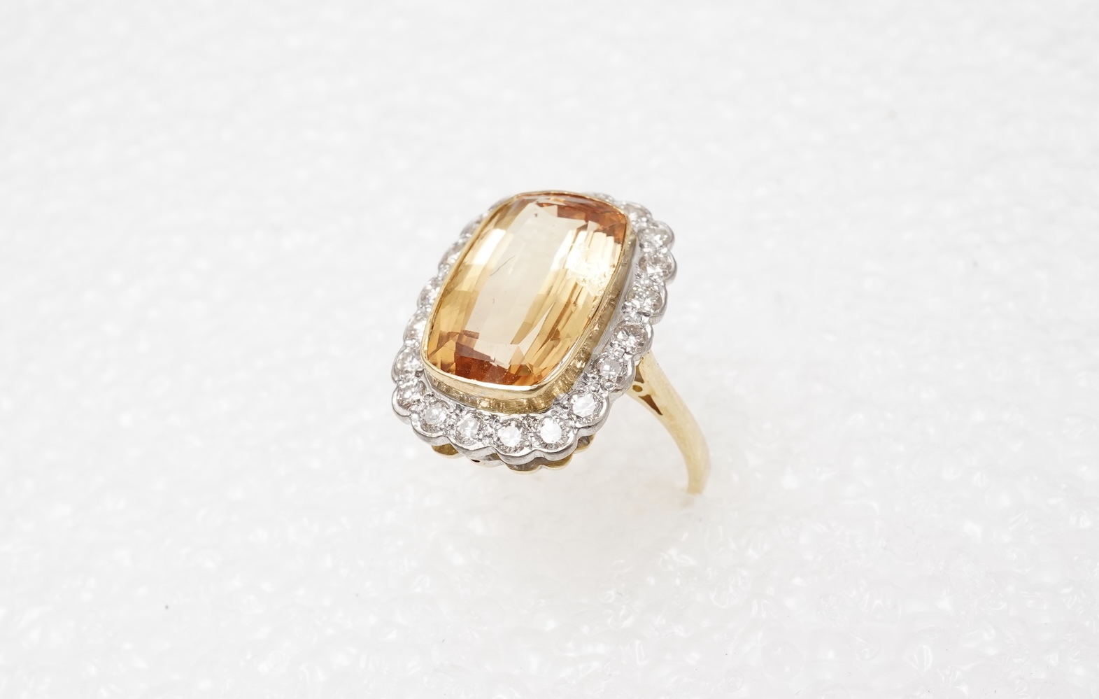 A topaz and diamond cluster ring